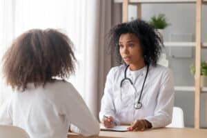 Black pediatrician and teen