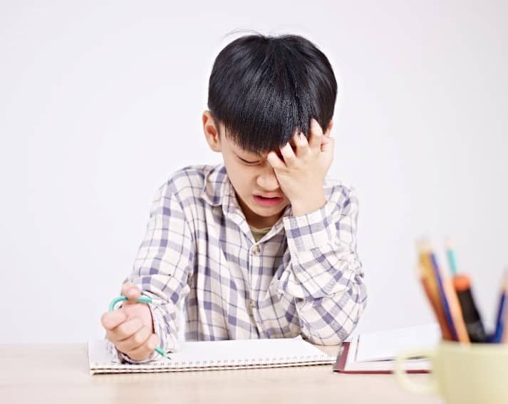 photo of child struggling with school work