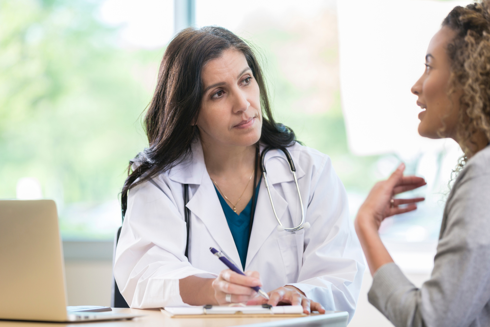 Doctor comforting patient.
